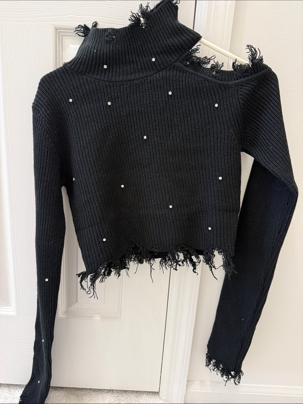 Signature Black Ribbed Knit Turtleneck Sweater. Open shoulder on left. Size sm